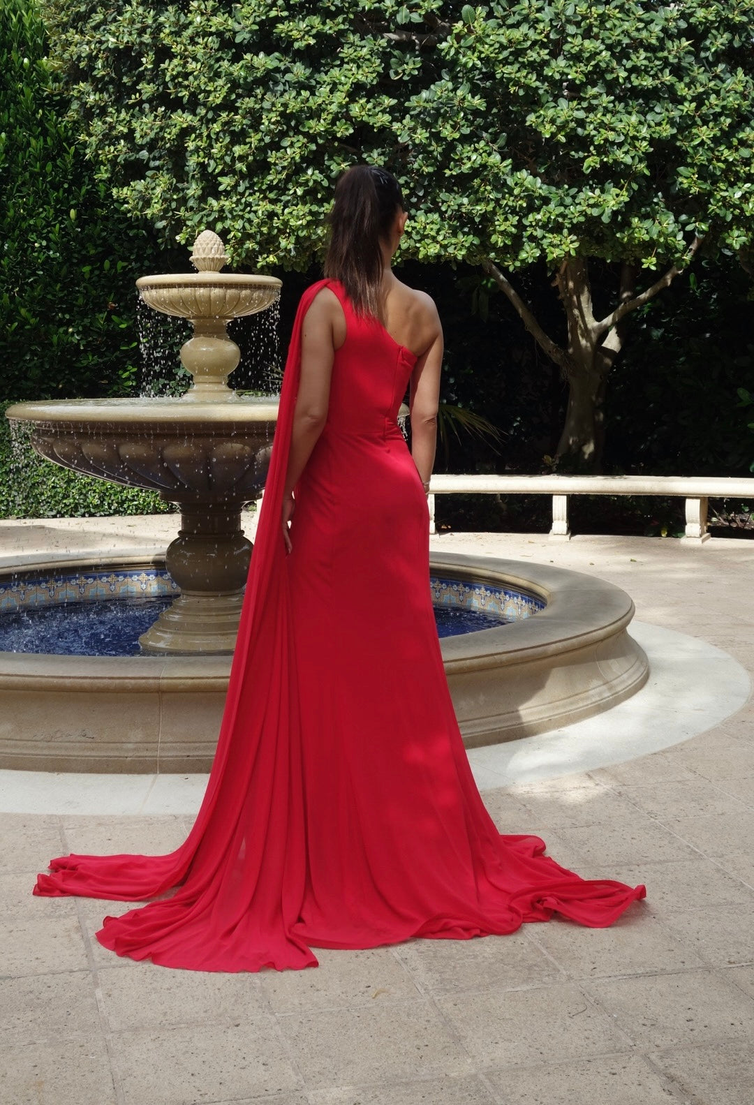 Ruby Radiance gown in striking red, featuring a sleek silhouette and luxurious design, perfect for formal events, evening galas, or red-carpet occasions