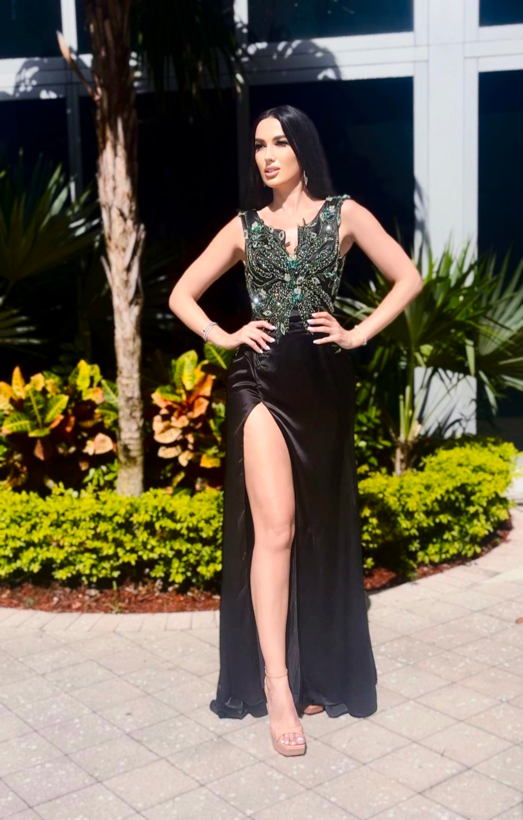 Jessica Noir black silk satin dress with intricate green stone embroidery, combining elegance and luxury for formal events, evening wear, or special occasions