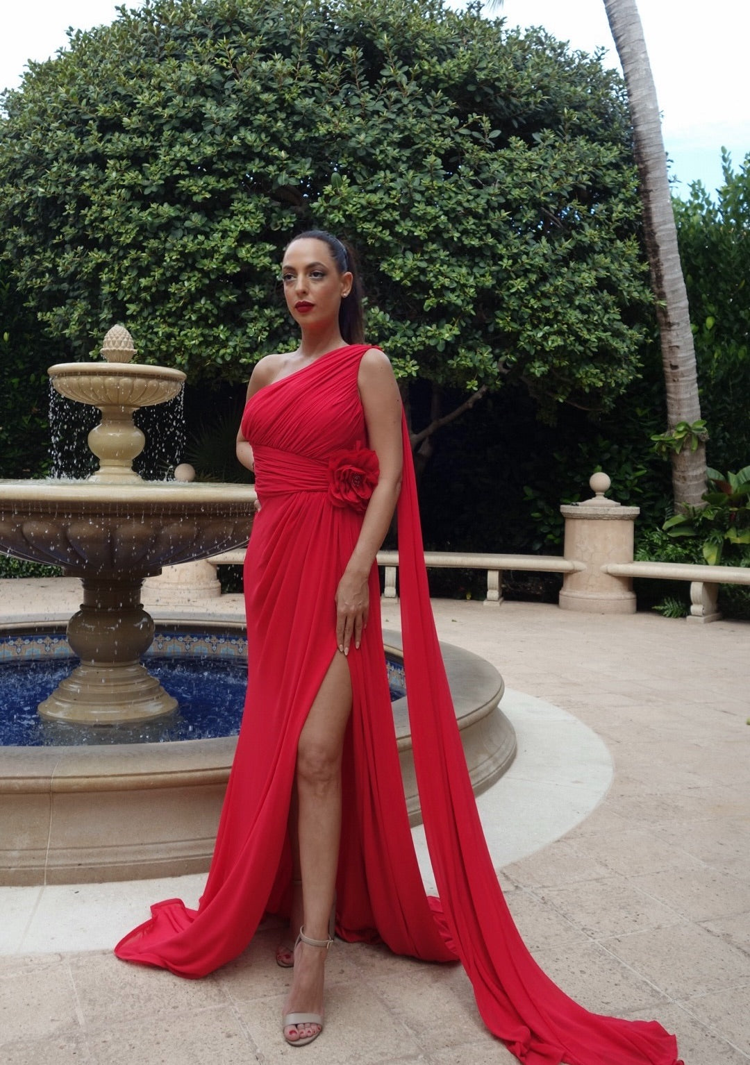 Ruby Radiance gown in striking red, featuring a sleek silhouette and luxurious design, perfect for formal events, evening galas, or red-carpet occasions