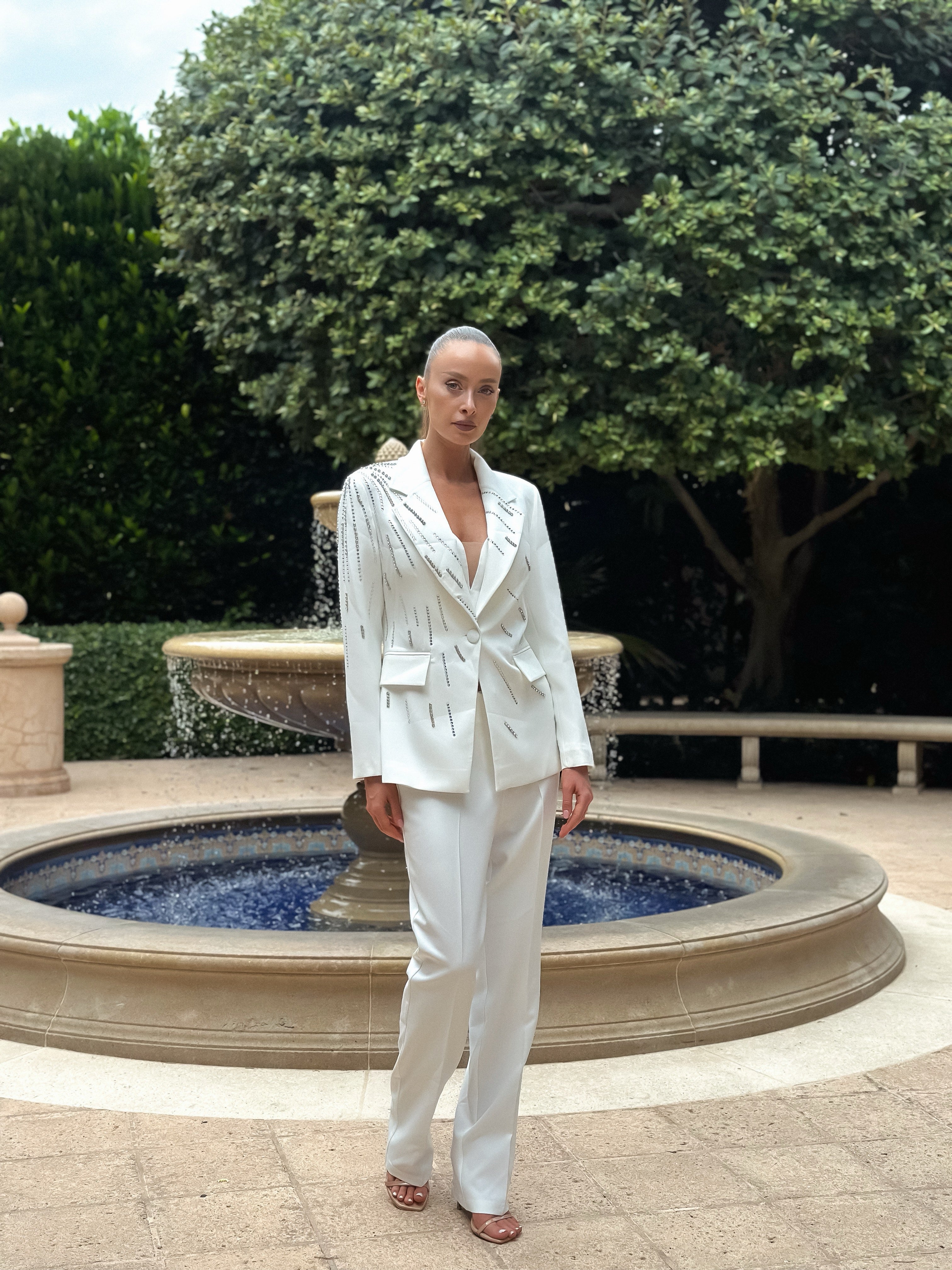 Stardust White Suit with a structured blazer featuring linear crystal accents and sleek straight-cut trousers, perfect for formal events and evening gatherings with a touch of understated glamour.